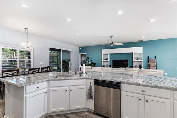 Dining room, Interior, Kitchen, Pendant Lights, Recessed Lighting, Stainless Steel Appliances, Wood Texture Flooring