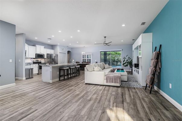 Dining room, Interior, Kitchen, Living room, Pendant Lights, Recessed Lighting, Stainless Steel Appliances, Wood Texture Flooring