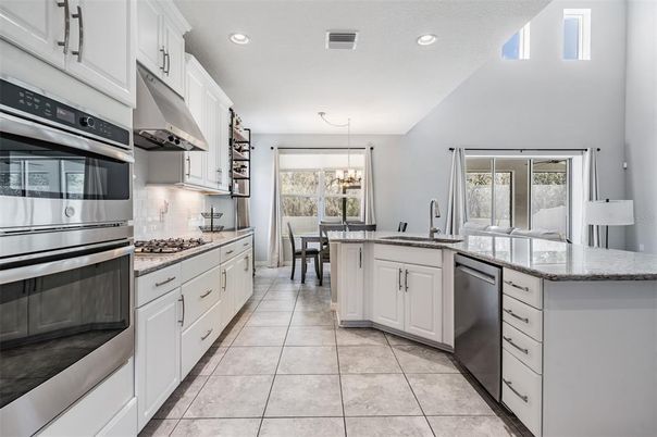 Chandelier, Dining room, Interior, Kitchen, Recessed Lighting, Stainless Steel Appliances