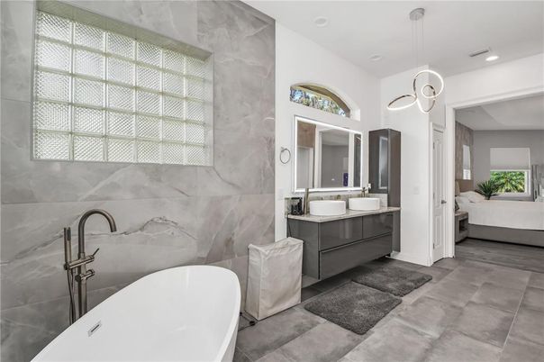 Bathroom, Dual Sink Vanities, Free Standing Baths, Interior, Marble Walls, Pendant Lights, Recessed Lighting
