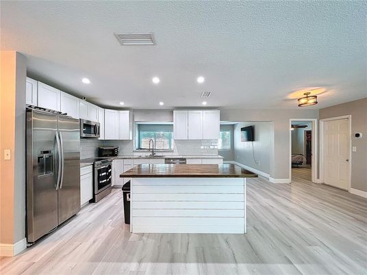 Interior, Kitchen, Recessed Lighting, Stainless Steel Appliances, Wood Texture Flooring
