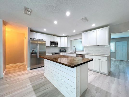 Interior, Kitchen, Recessed Lighting, Stainless Steel Appliances, Wood Texture Flooring