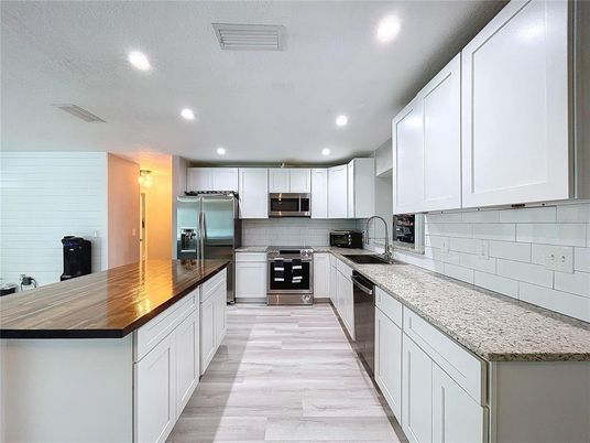 Interior, Kitchen, Recessed Lighting, Stainless Steel Appliances, Wood Texture Flooring