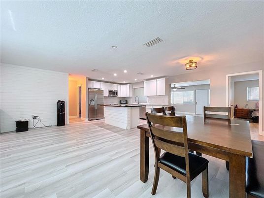 Dining room, Interior, Kitchen, Recessed Lighting, Stainless Steel Appliances, Wood Texture Flooring