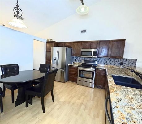 Dining room, Interior, Kitchen, Pendant Lights, Stainless Steel Appliances, Wood Texture Flooring