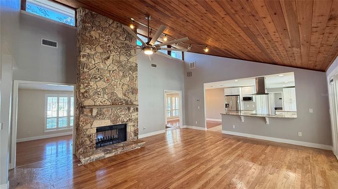 Empty room, Fireplace, Interior, Kitchen, Recessed Lighting, Stone Walls, Wooden Ceilings, Wood Texture Flooring