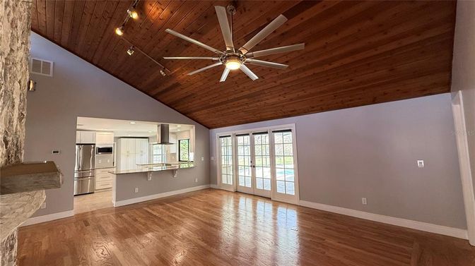 Empty room, Interior, Kitchen, Recessed Lighting, Stainless Steel Appliances, Wooden Ceilings, Wood Texture Flooring