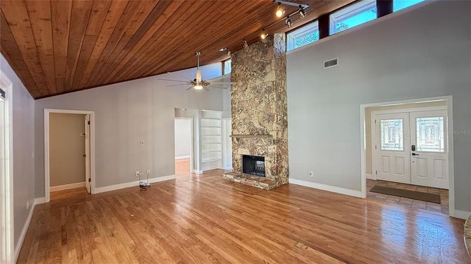 Empty room, Fireplace, Interior, Stone Walls, Wooden Ceilings, Wood Texture Flooring