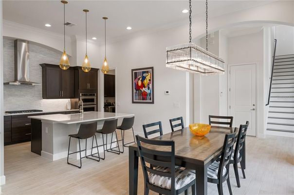 Chandelier, Dining room, Interior, Kitchen, Pendant Lights, Recessed Lighting, Stainless Steel Appliances, Wood Texture Flooring