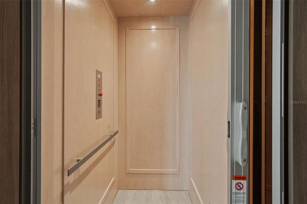 Elevator, Interior, Recessed Lighting, Wood Texture Flooring, Wooden Walls