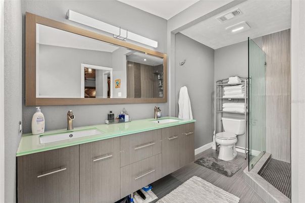 Bathroom, Dual Sink Vanities, Glass Shower, Interior, Recessed Lighting, Wood Texture Flooring