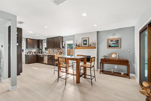 Dining room, Interior, Kitchen, Recessed Lighting, Stainless Steel Appliances, Wood Texture Flooring
