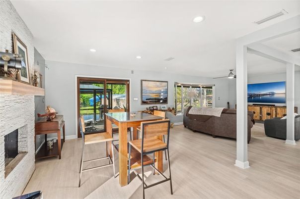 Dining room, Fireplace, Interior, Living room, Recessed Lighting, Wood Texture Flooring