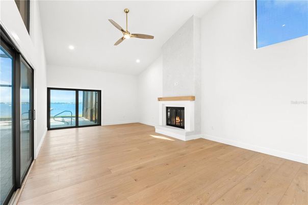 Empty room, Fireplace, Interior, Recessed Lighting, Water, Wood Texture Flooring