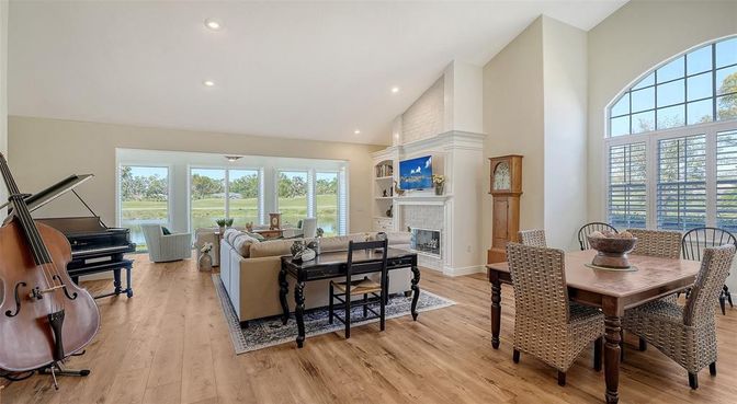 Dining room, Fireplace, Interior, Living room, Piano, Recessed Lighting, Wood Texture Flooring