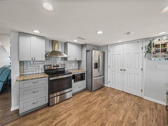 Interior, Kitchen, Recessed Lighting, Stainless Steel Appliances, Wood Texture Flooring