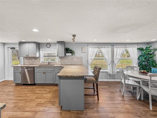 Dining room, Interior, Kitchen, Recessed Lighting, Stainless Steel Appliances, Wood Texture Flooring