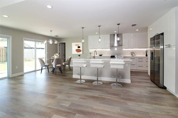 Dining room, Interior, Kitchen, Pendant Lights, Recessed Lighting, Stainless Steel Appliances, Wood Texture Flooring