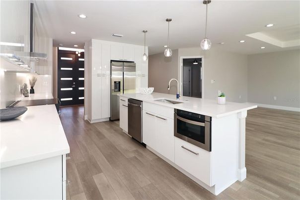 Interior, Kitchen, Pendant Lights, Recessed Lighting, Stainless Steel Appliances, Wood Texture Flooring