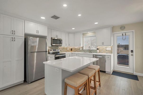Interior, Kitchen, Recessed Lighting, Stainless Steel Appliances, Wood Texture Flooring