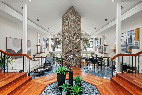 Fireplace, Interior, Living room, Piano, Recessed Lighting, Stone Walls, Wood Texture Flooring