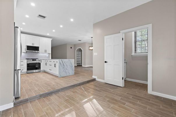 Interior, Kitchen, Pendant Lights, Recessed Lighting, Stainless Steel Appliances, Wood Texture Flooring