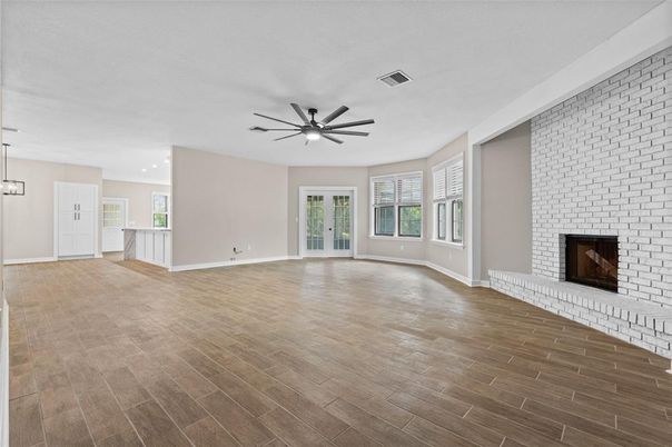 Empty room, Fireplace, Interior, Pendant Lights, Recessed Lighting, Stone Walls, Wood Texture Flooring