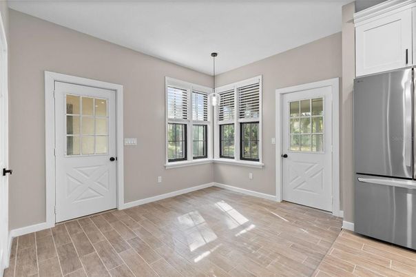 Empty room, Interior, Kitchen, Pendant Lights, Stainless Steel Appliances, Wood Texture Flooring