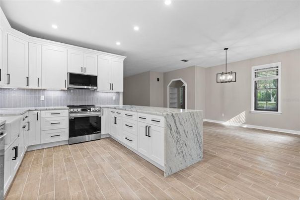 Interior, Kitchen, Pendant Lights, Recessed Lighting, Stainless Steel Appliances, Wood Texture Flooring