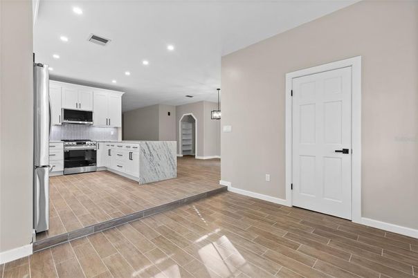 Interior, Kitchen, Pendant Lights, Recessed Lighting, Stainless Steel Appliances, Wood Texture Flooring