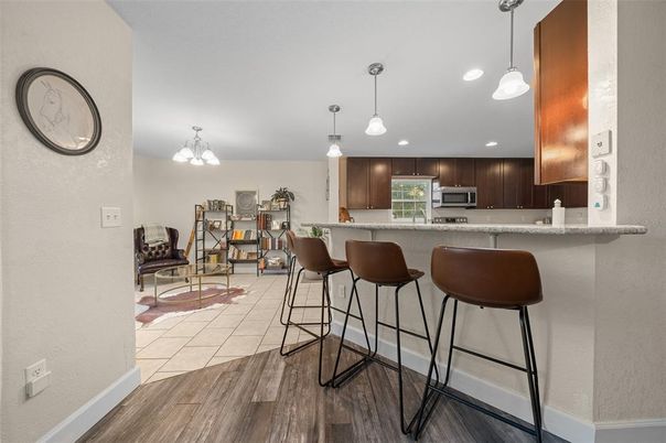 Dining room, Interior, Kitchen, Pendant Lights, Recessed Lighting, Stainless Steel Appliances, Wood Texture Flooring