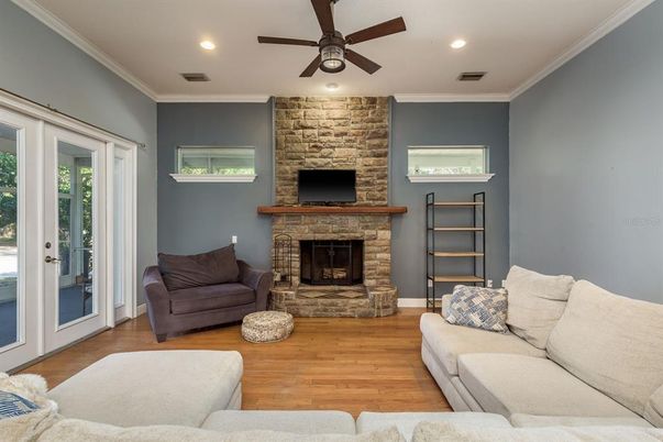 Fireplace, Interior, Living room, Recessed Lighting, Stone Walls, Wood Texture Flooring