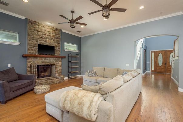 Fireplace, Interior, Living room, Recessed Lighting, Stone Walls, Wood Texture Flooring