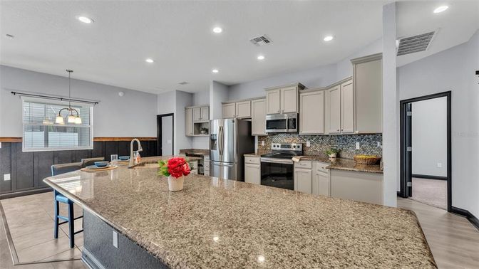 Dining room, Interior, Kitchen, Pendant Lights, Recessed Lighting, Stainless Steel Appliances, Wood Texture Flooring