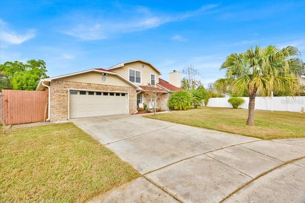 Attached, Backyard, Exterior, Facade, Brick Facade, Mediterranean