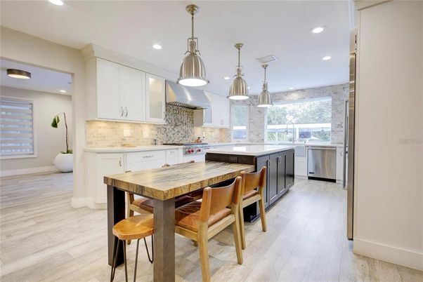 Dining room, Interior, Kitchen, Pendant Lights, Recessed Lighting, Stainless Steel Appliances, Wood Texture Flooring