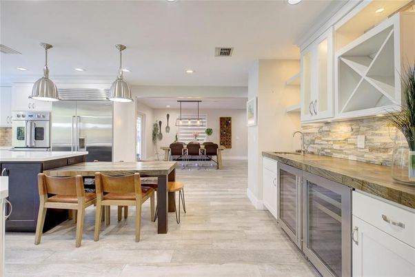 Dining room, Interior, Kitchen, Pendant Lights, Recessed Lighting, Stainless Steel Appliances, Wood Texture Flooring