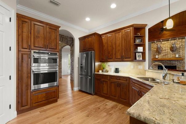 Interior, Kitchen, Pendant Lights, Recessed Lighting, Stainless Steel Appliances, Stone Walls, Wood Texture Flooring