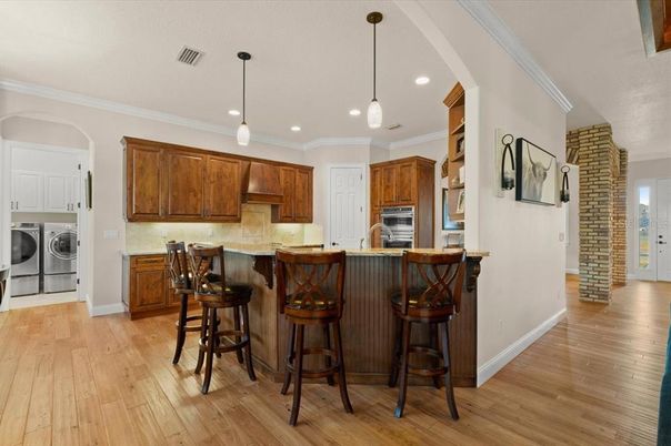 Interior, Kitchen, Pendant Lights, Recessed Lighting, Stainless Steel Appliances, Washer, Wood Texture Flooring