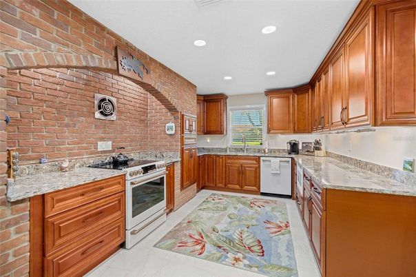 Interior, Kitchen, Recessed Lighting, Stainless Steel Appliances, Stone Walls