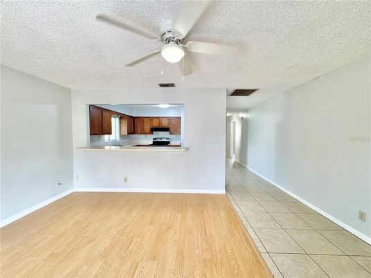 Empty room, Interior, Kitchen, Stainless Steel Appliances, Wood Texture Flooring