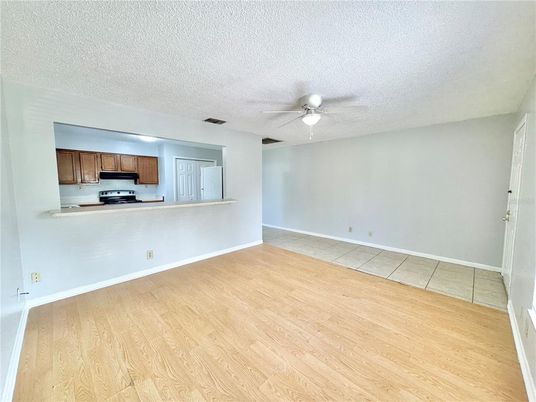 Empty room, Interior, Kitchen, Stainless Steel Appliances, Wood Texture Flooring
