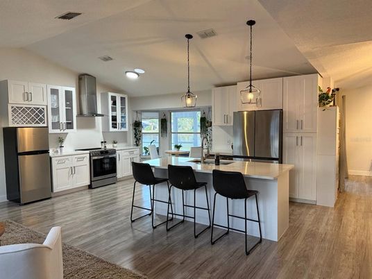Interior, Kitchen, Pendant Lights, Recessed Lighting, Stainless Steel Appliances, Wood Texture Flooring