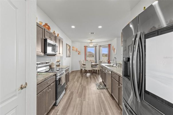 Dining room, Interior, Kitchen, Recessed Lighting, Stainless Steel Appliances, Wood Texture Flooring