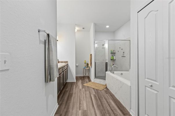 Bathroom, Glass Shower, Interior, Marble Walls, Recessed Lighting, Wood Texture Flooring