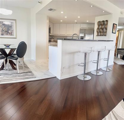 Dining room, Interior, Kitchen, Marble, Pendant Lights, Recessed Lighting, Stainless Steel Appliances, Wood Texture Flooring