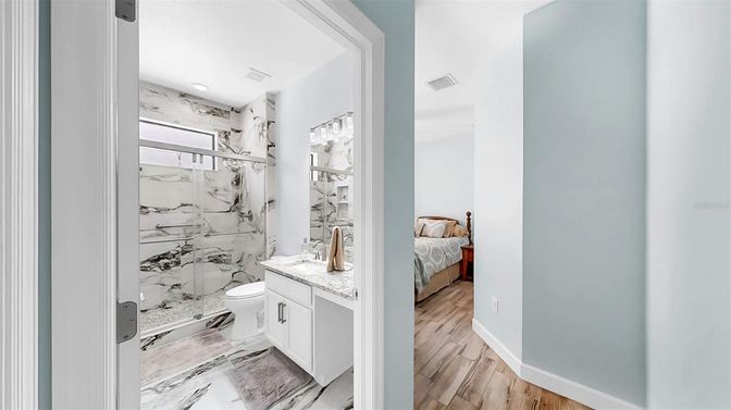Bathroom, Bedroom, Glass Shower, Interior, Marble, Marble Walls, Recessed Lighting, Wood Texture Flooring