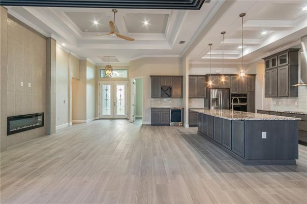 Fireplace, Interior, Kitchen, Pendant Lights, Recessed Lighting, Stainless Steel Appliances, Wood Texture Flooring