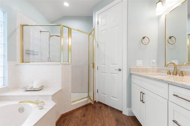 Bathroom, Dual Sink Vanities, Glass Shower, Interior, Recessed Lighting, Wood Texture Flooring