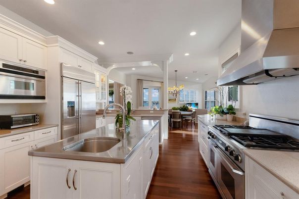 Chandelier, Dining room, Interior, Kitchen, Pendant Lights, Recessed Lighting, Stainless Steel Appliances, Wood Texture Flooring
